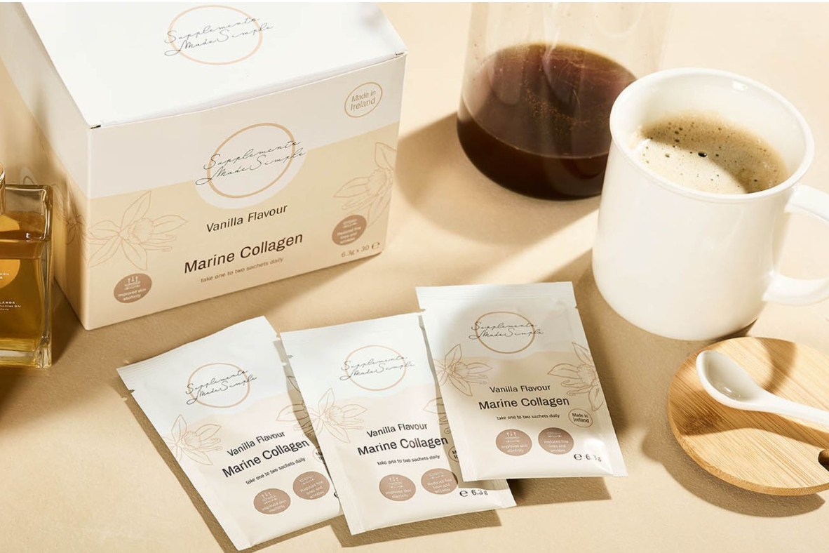 Supplements Made Simple Vanilla Marine Collagen sachets and box beside a coffee cup, highlighting one of the best marine collagen supplements in Ireland for supporting healthy skin, hair and nails. 